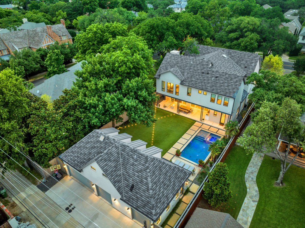 Highland Park, Texas, Highland Park, HP, Custom Home, 4 car garage, back house, guest house, Phillip Jennings Custom Homes, Dallas, Texas, quartz pool plaster, turf yard, string lights, blue clad windows, outdoor firepit, outdoor living, outdoor dining.