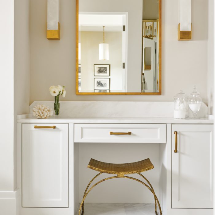 Luxury home bathroom vanity with gold accents and marble countertop