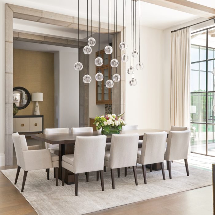 Elegant dining room with globe pendant lights and custom table
